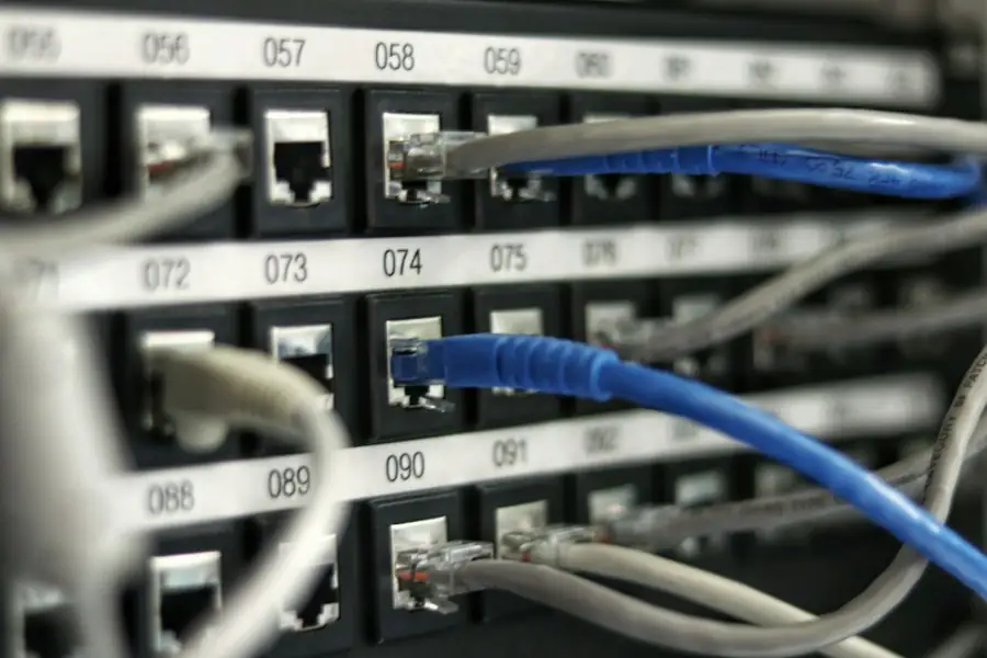 Patch panel with numbered ports and cables