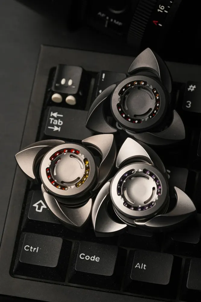 Metal fidget spinners on a keyboard